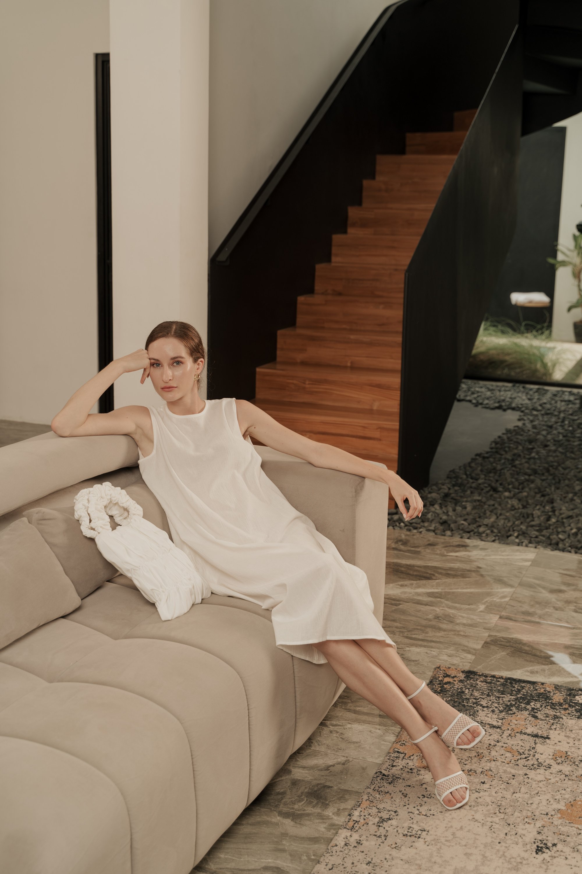 Elegant Woman Sitting on the Sofa